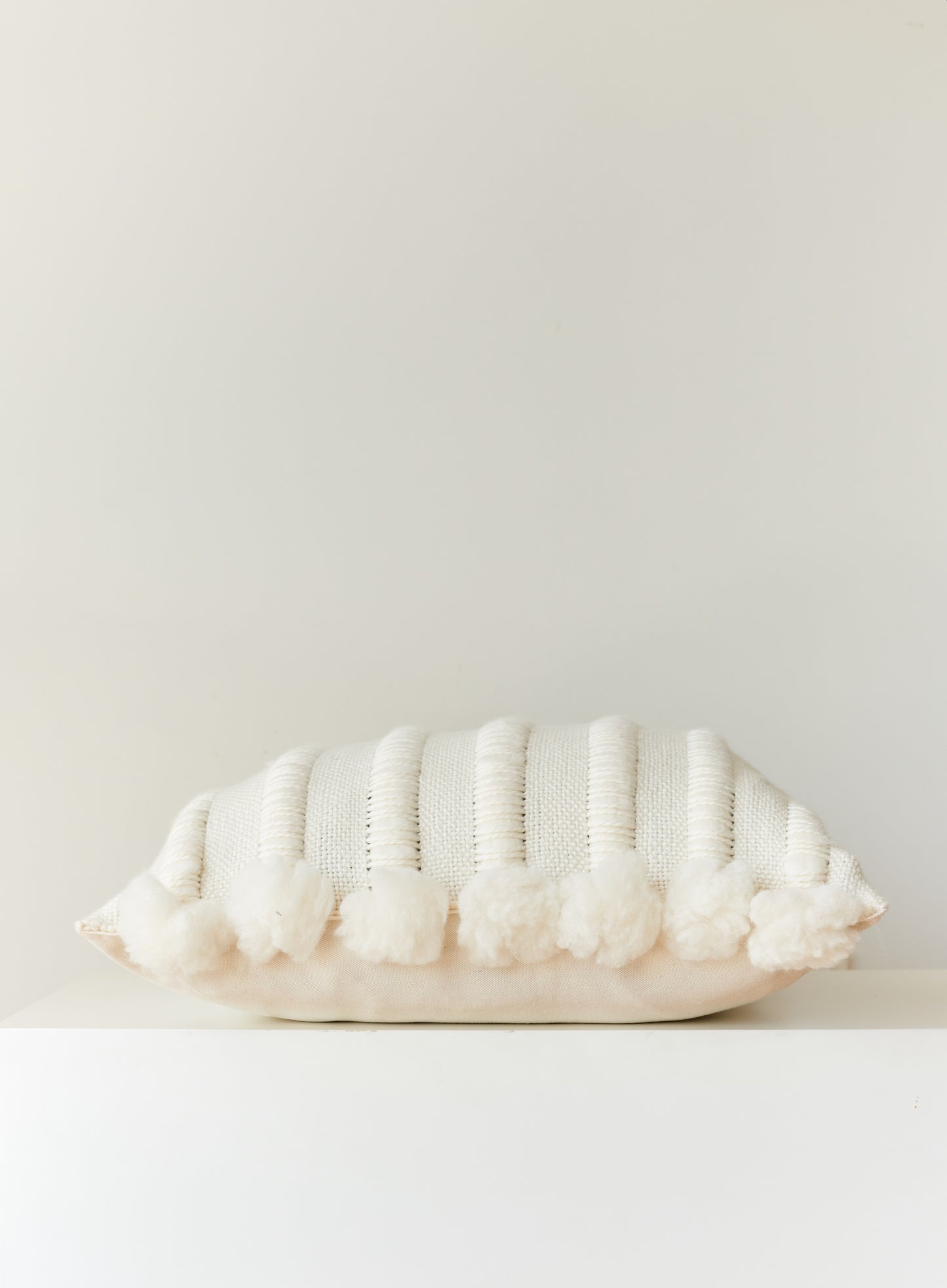 both sides chunky pillow cover with pom poms in natural wool color