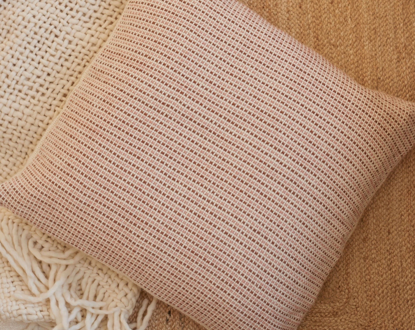 Textured Cover Cushion on a blanket and rug