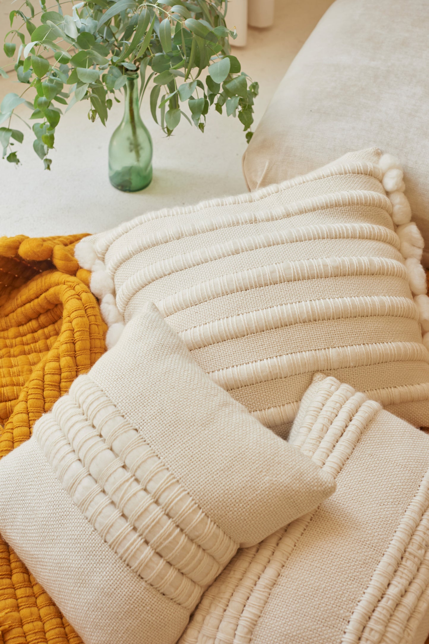 Three cushion covers with diferent designs of handwoven chunky merino wool