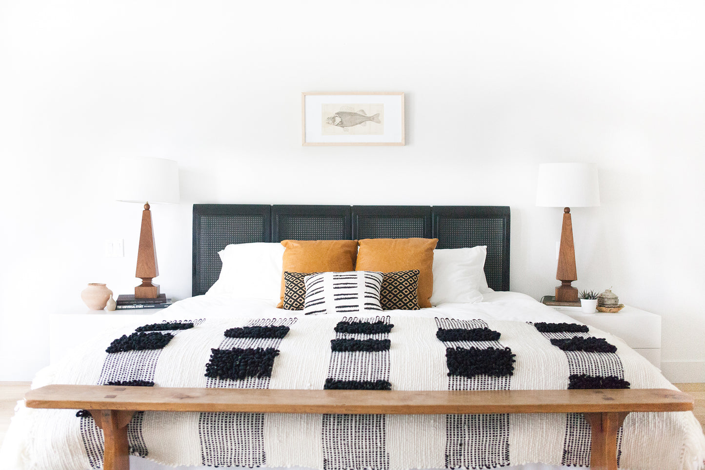 Off white & black Loops Blanket over the bed in a bedroom decor
