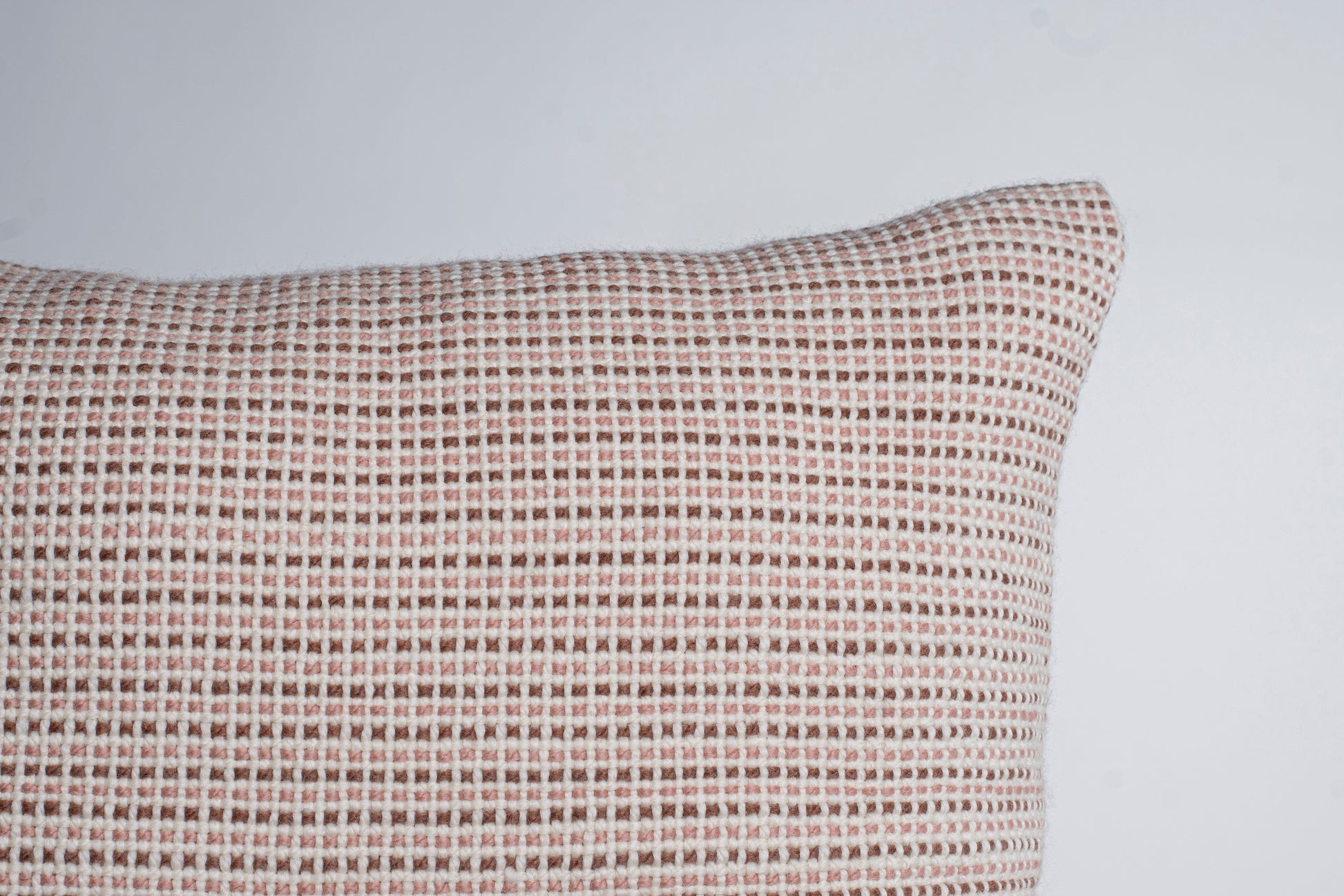 partial square cushion cover handwoven in merino wool and textured in dusty rose and current