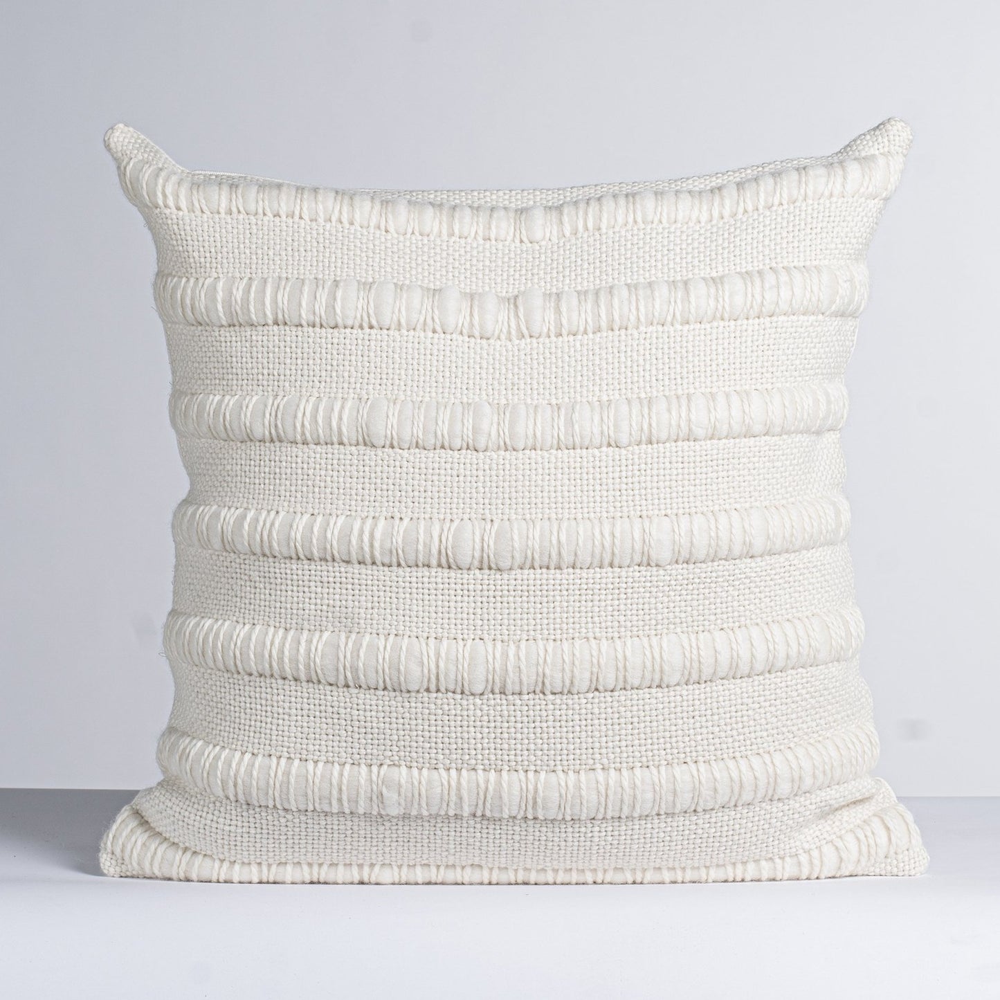 Cream handwoven cushion cover with chunky stripes of roving merino wool