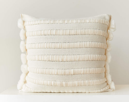 Throw pillow cover hand weaving with chunky stripes and pom poms in natural merino wool